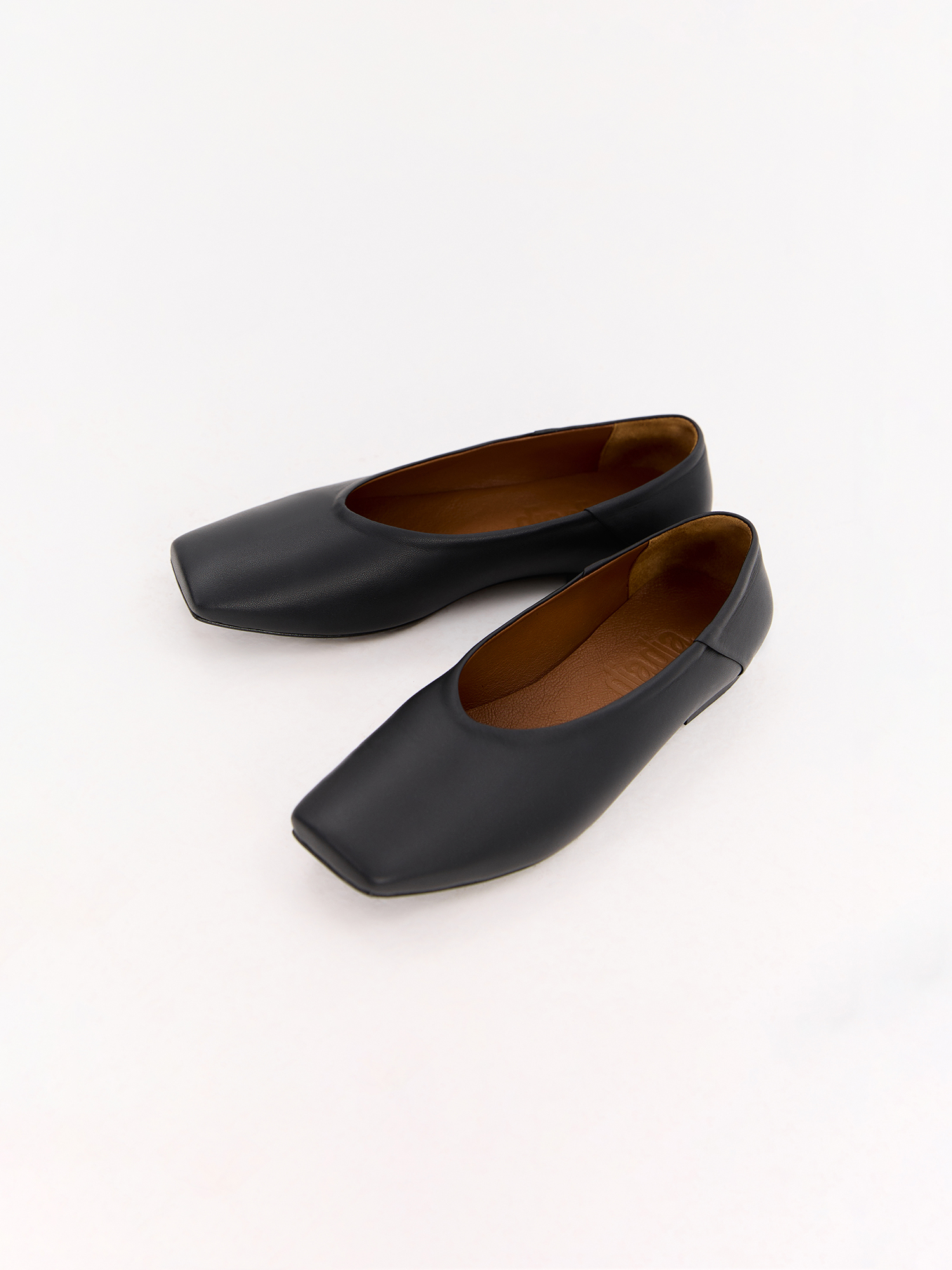 Black leather ballet flats