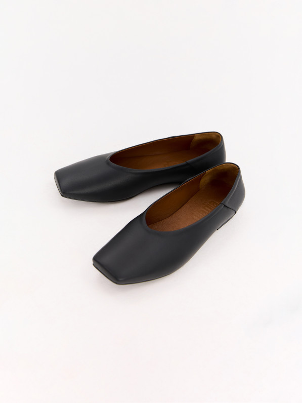 Black leather ballet flats