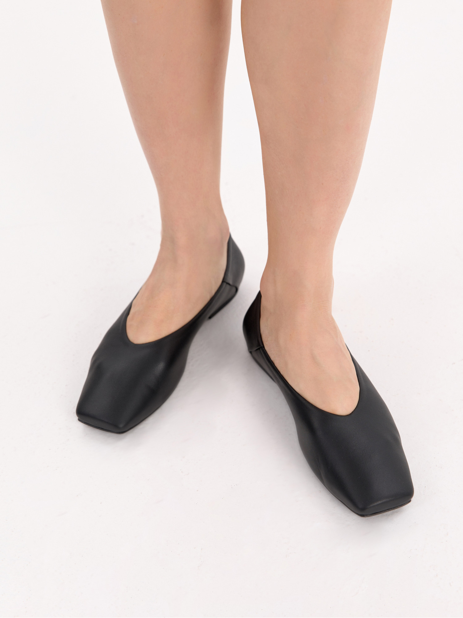 Black leather ballet flats